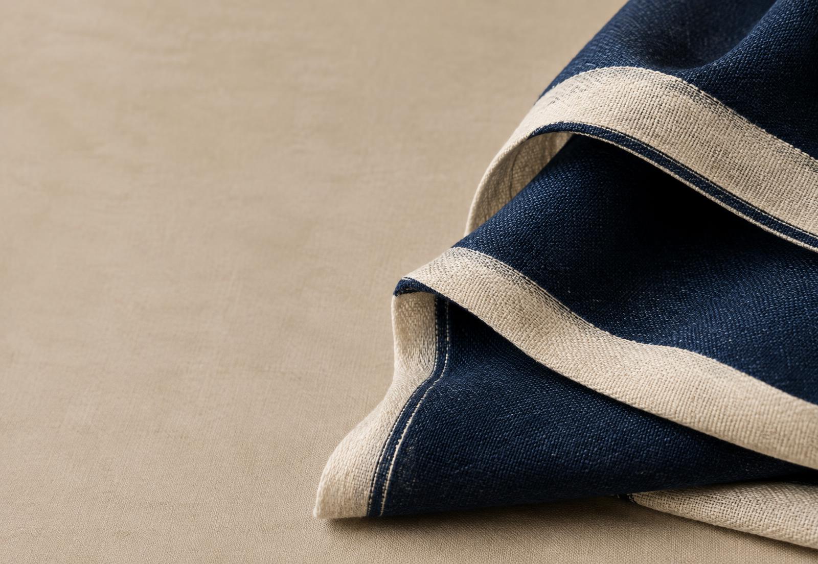 Indigo woven fabric with a natural selvedge